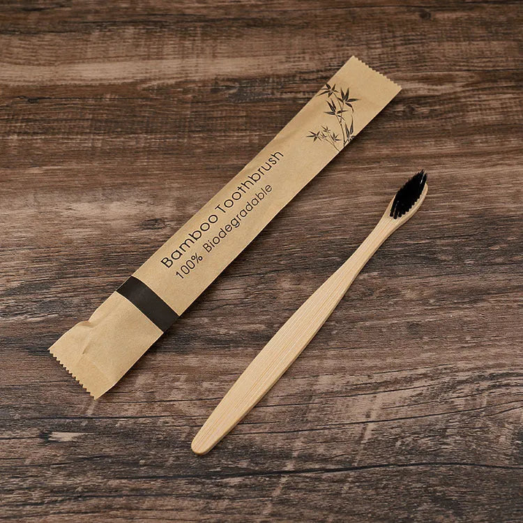 10 bamboo toothbrushes with soft charcoal bristles in assorted colours arranged fanned out