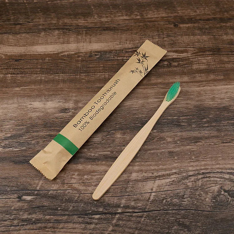 10 bamboo toothbrushes with soft charcoal bristles in assorted colours arranged fanned out