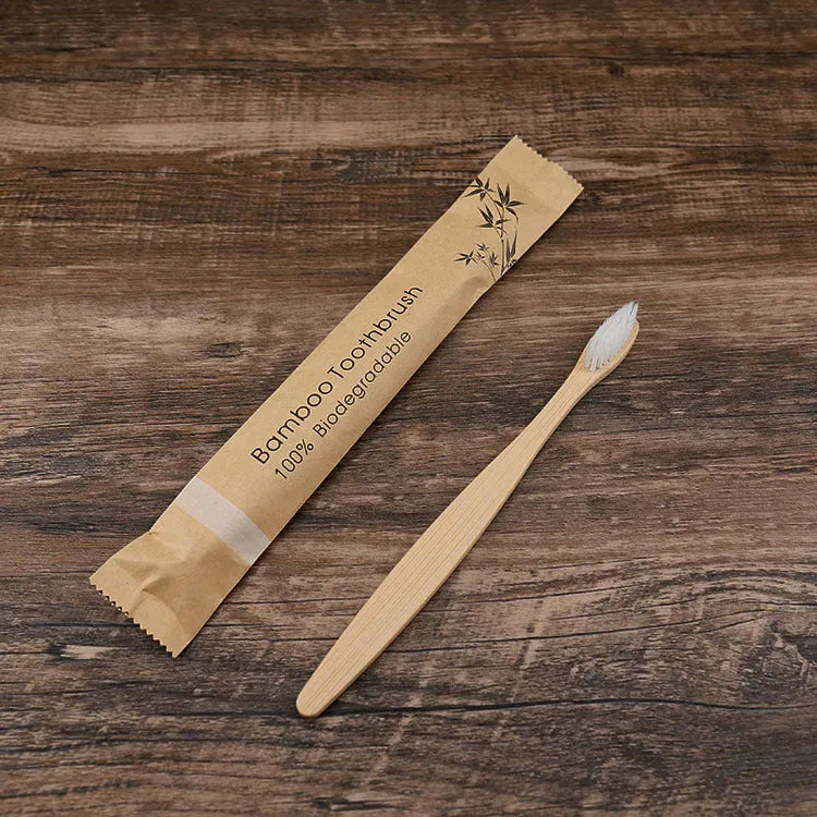 10 bamboo toothbrushes with soft charcoal bristles in assorted colours arranged fanned out