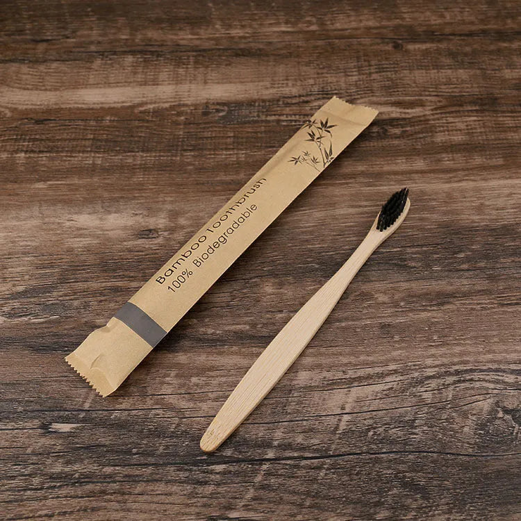 10 bamboo toothbrushes with soft charcoal bristles in assorted colours arranged fanned out