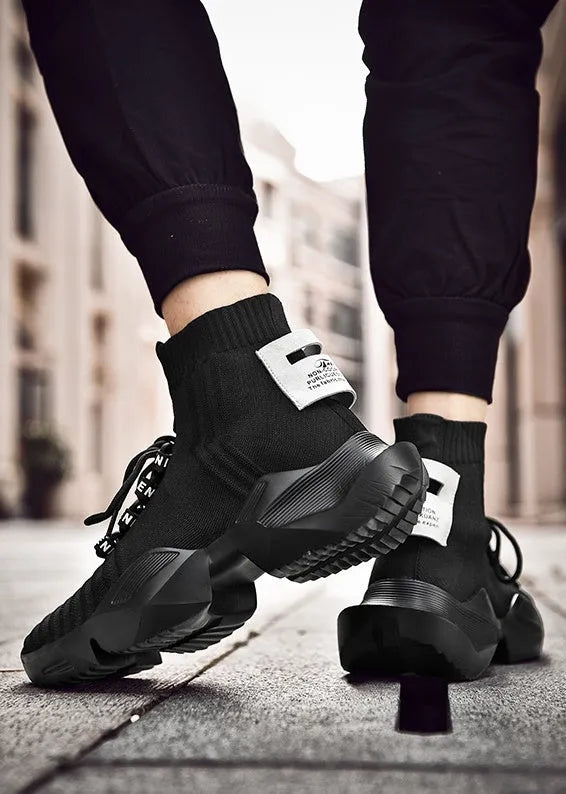 Men's black and white casual sports shoes showing mesh lining and large size options.