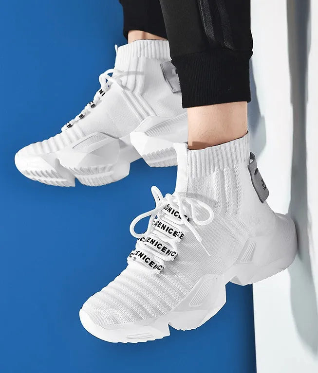 Men's black and white casual sports shoes showing mesh lining and large size options.