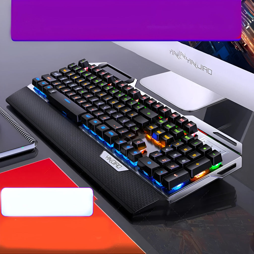 Silver Carving K100 metal mechanical keyboard with black keys and seven-color backlight on a desk
