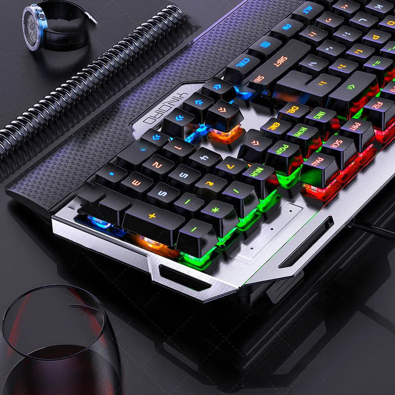 Silver Carving K100 metal mechanical keyboard with black keys and seven-color backlight on a desk