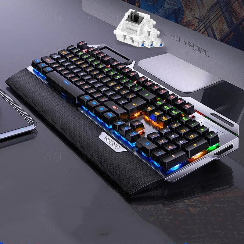 Silver Carving K100 metal mechanical keyboard with black keys and seven-color backlight on a desk