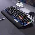 Silver Carving K100 metal mechanical keyboard with black keys and seven-color backlight on a desk