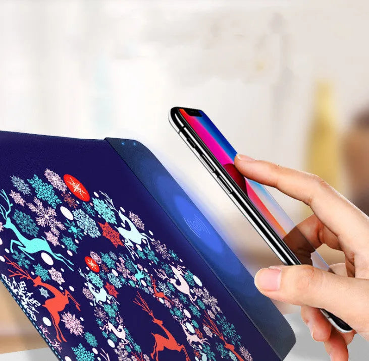 Cartoon design wireless charging mouse pad with RGB lights on a desk