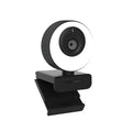 Black USB webcam on a desk with a 1.7m cable, showing a magnetic privacy cover next to the lens.