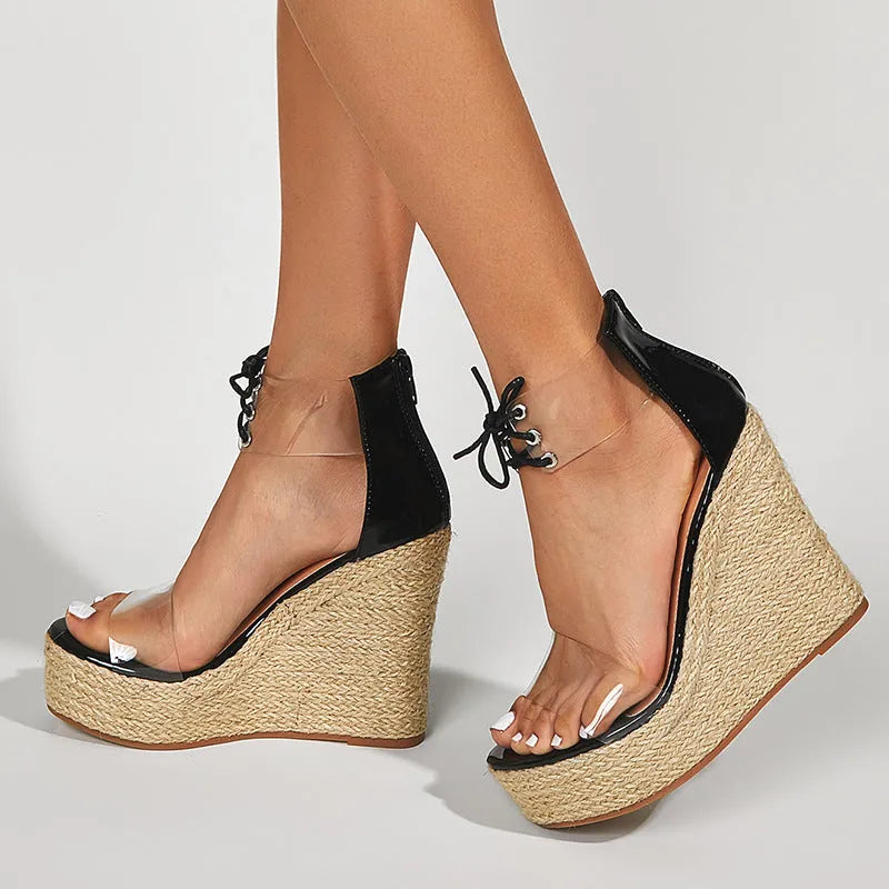 Black women's wedge sandals with hemp rope detail and front tie fastening on 8cm wedge heel