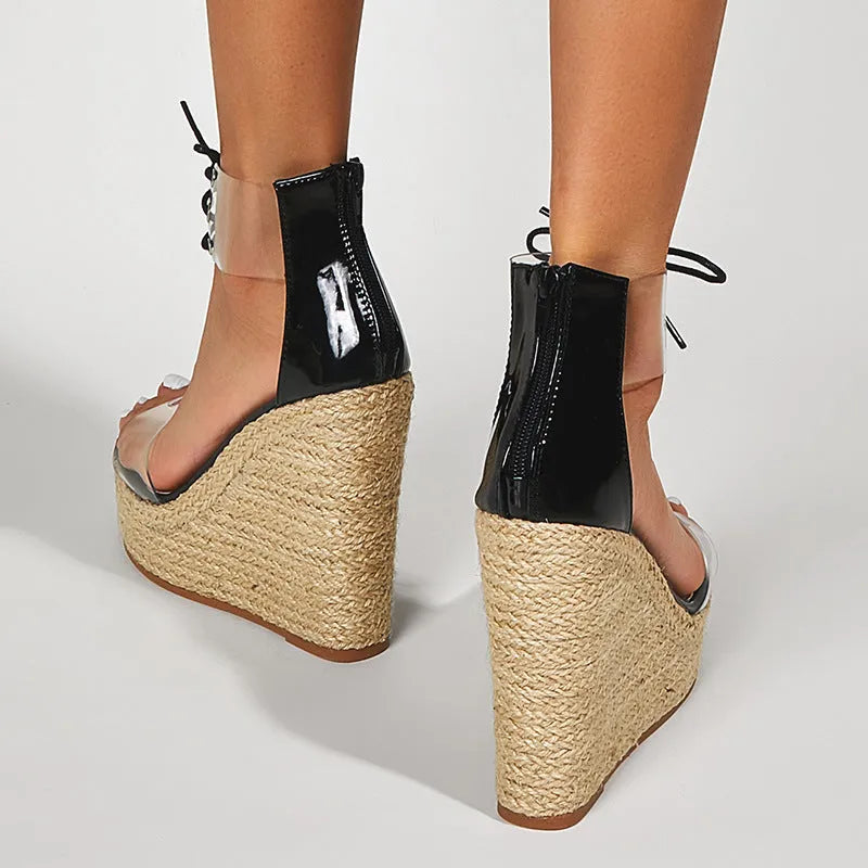 Black women's wedge sandals with hemp rope detail and front tie fastening on 8cm wedge heel