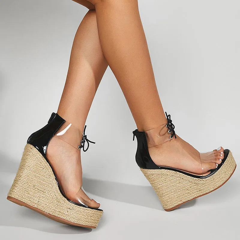 Black women's wedge sandals with hemp rope detail and front tie fastening on 8cm wedge heel
