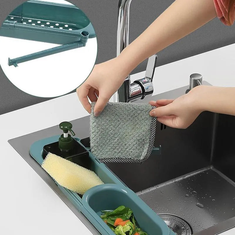 Telescopic sink rack in blue grey with sponge and soap on drainer, bar towel holder attached, stable PP construction