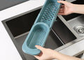 Telescopic sink rack in blue grey with sponge and soap on drainer, bar towel holder attached, stable PP construction