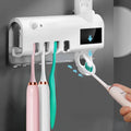 Intelligent UV toothbrush sterilizer with automatic toothpaste squeezer in black, wall-mounted