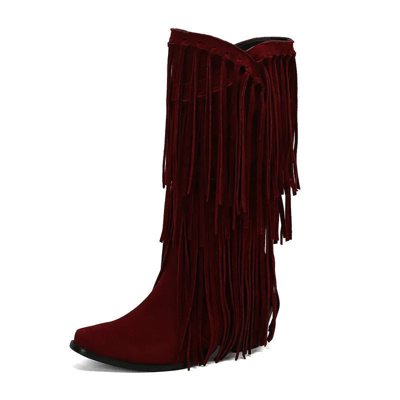 Women's beige suede below-the-knee boots with tassels and a chunky heel on a waterproof platform sole.