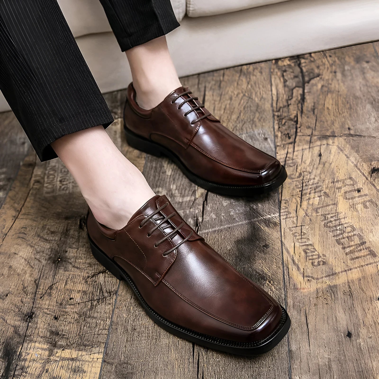 Men's low-top square toe business casual leather shoes in black with sewing thread detailing and rubber sole