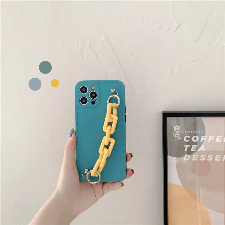 Huawei phone case with photo frame back and candy-coloured chain bracelet strap in pink and light blue