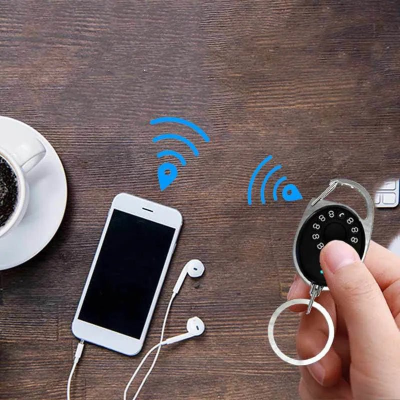Black smart Bluetooth anti-lost device with selfie function, keychain design, compatible with Apple iPhone