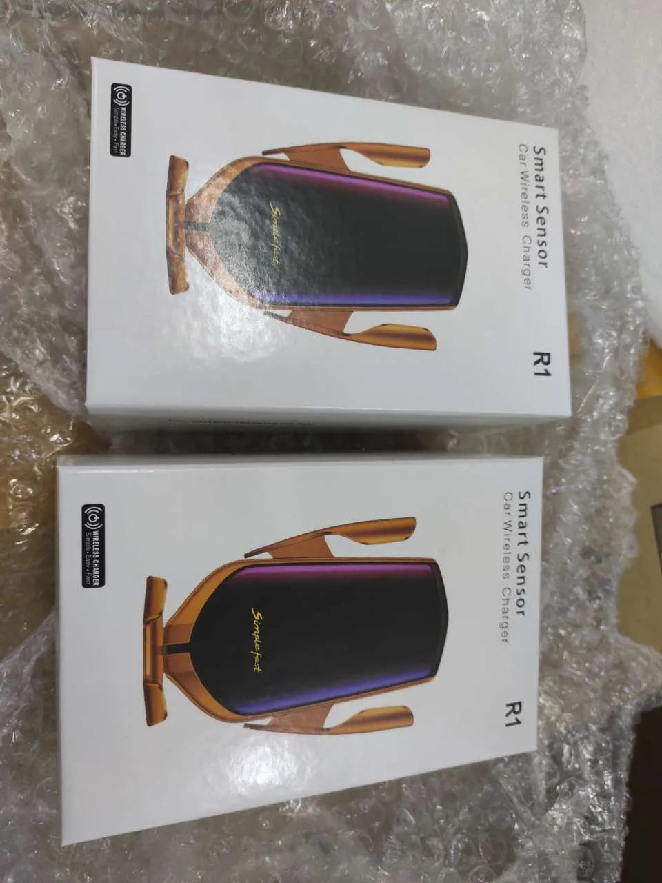Magic Clip R1 automatic car mobile phone holder wireless charger in gold or silver mounted on dashboard