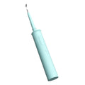 Black dental calculus household scaler with handle, storage tray, cleaning heads, and USB cable on white background