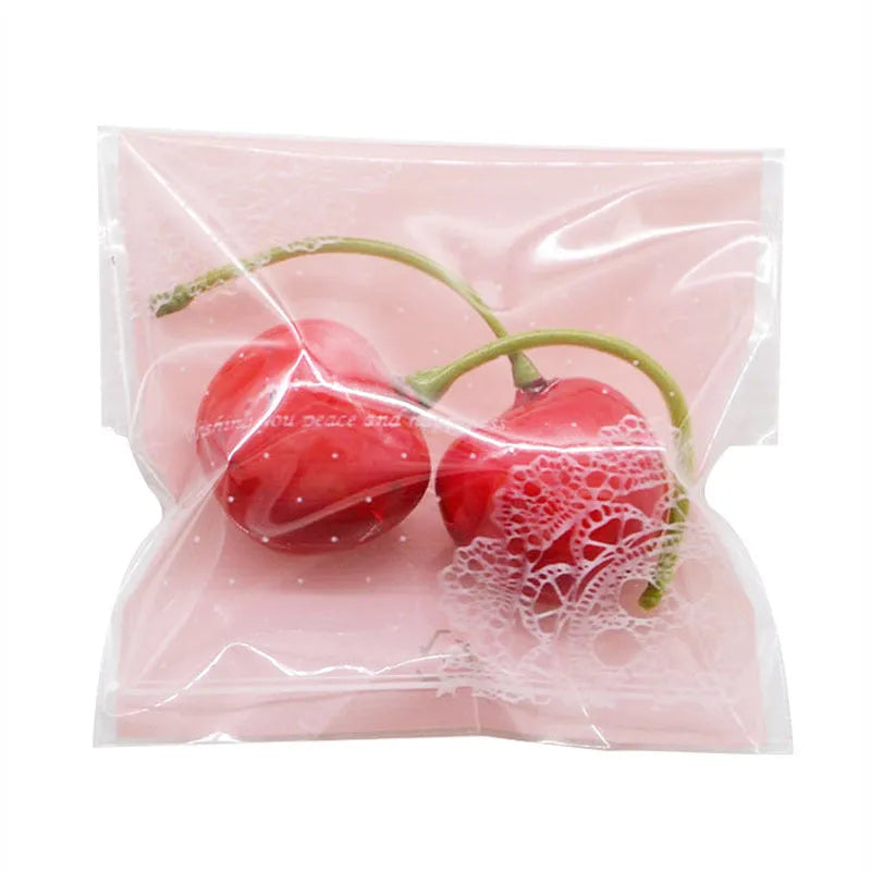 Pink self-adhesive plastic packaging bag with clear window and resealable strip, shown flat and filled.