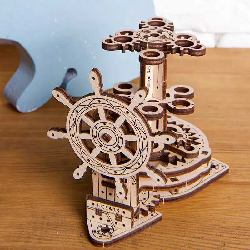 Ukrainian wooden rotating machinery model pen holder on a desk