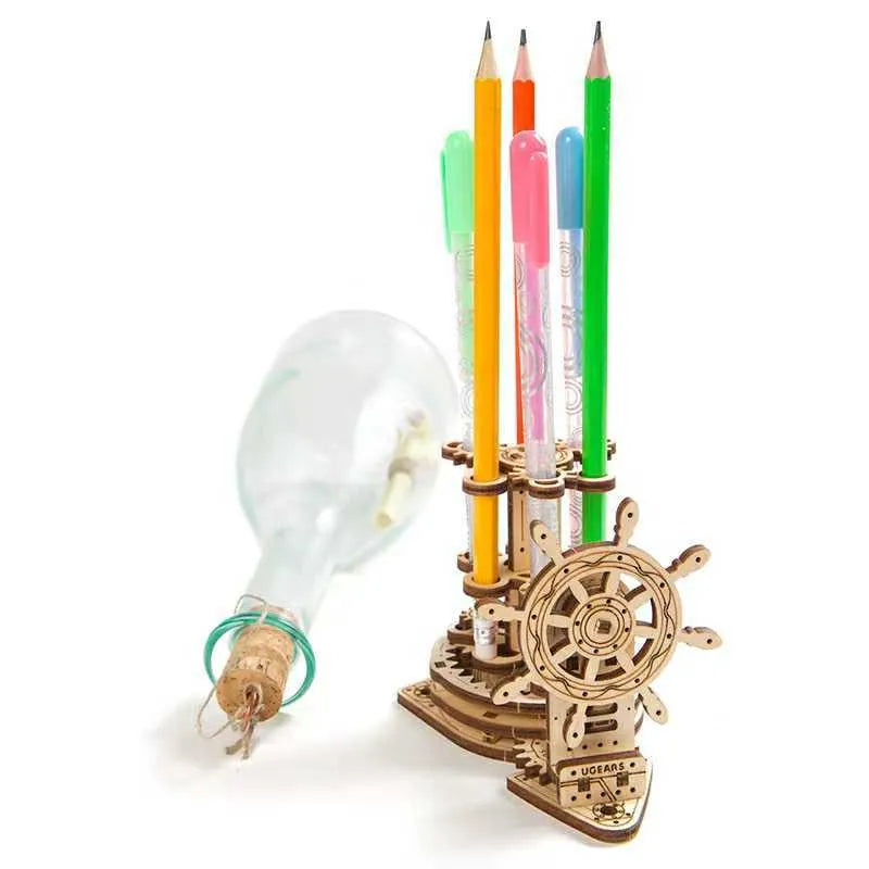 Ukrainian wooden rotating machinery model pen holder on a desk