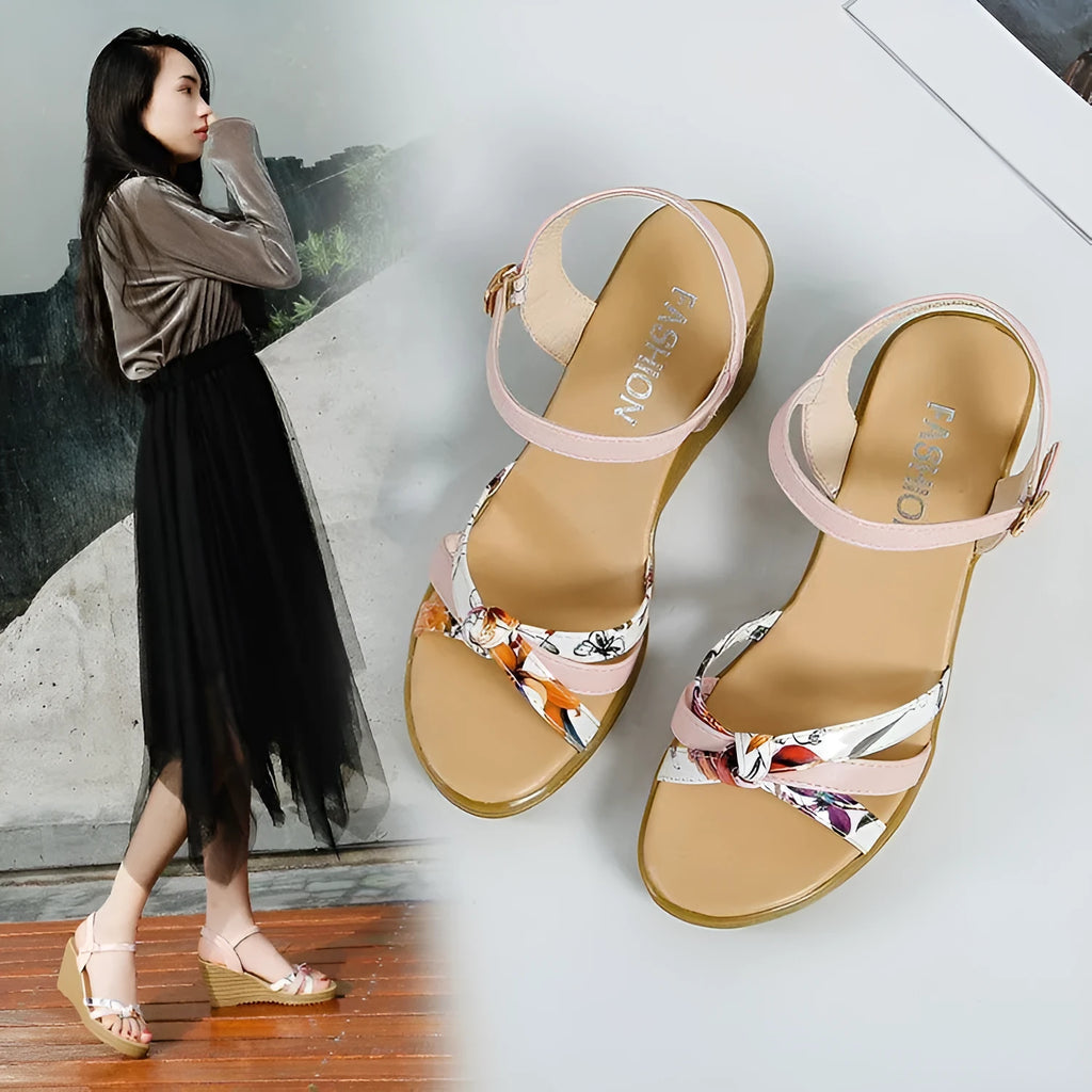 Women's pink wedge sandals with thick heel, fish mouth front, and buckle closure on non-slip sole