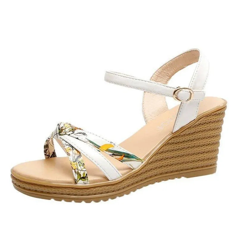 Women's pink wedge sandals with thick heel, fish mouth front, and buckle closure on non-slip sole