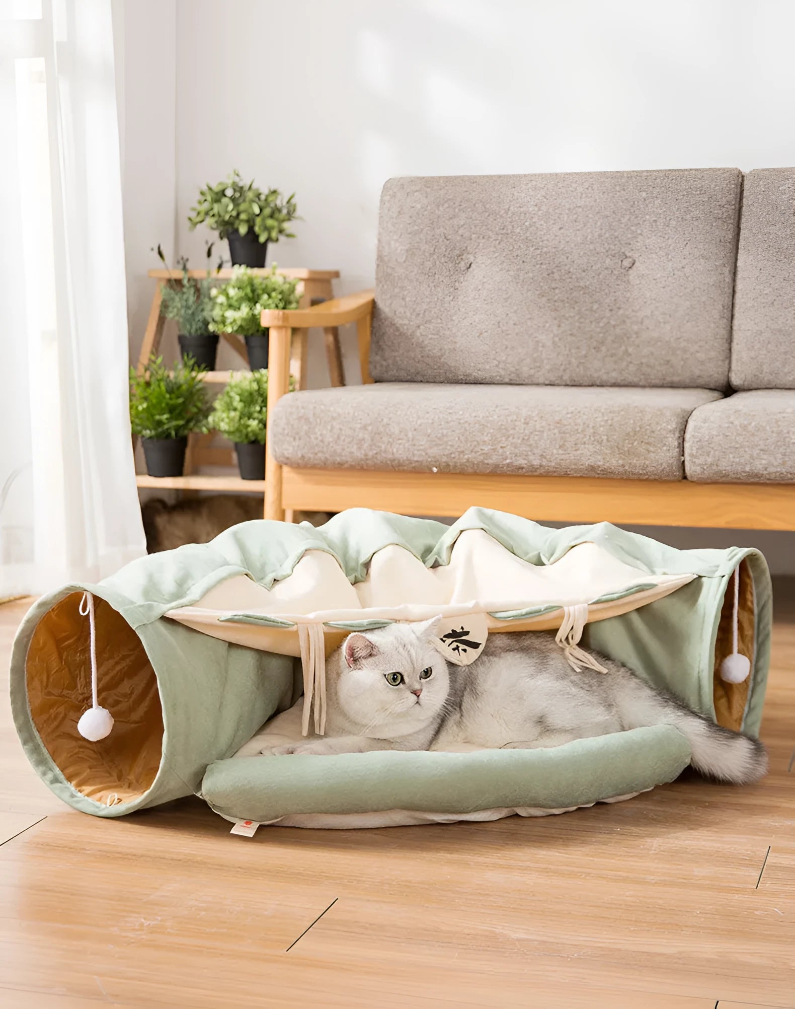 Collapsible pink cloth cat tunnel for small cats folded next to unfolded tunnel