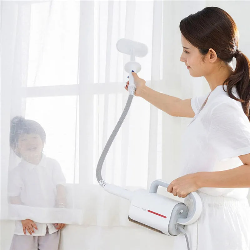 Deerma ZQ610 white steam cleaner with five brush heads, glass scraper, and corrugated pipe on a light background