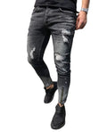 Men's black ripped denim jeans with zipper and elasticated ankle cuffs, shown flat on surface.