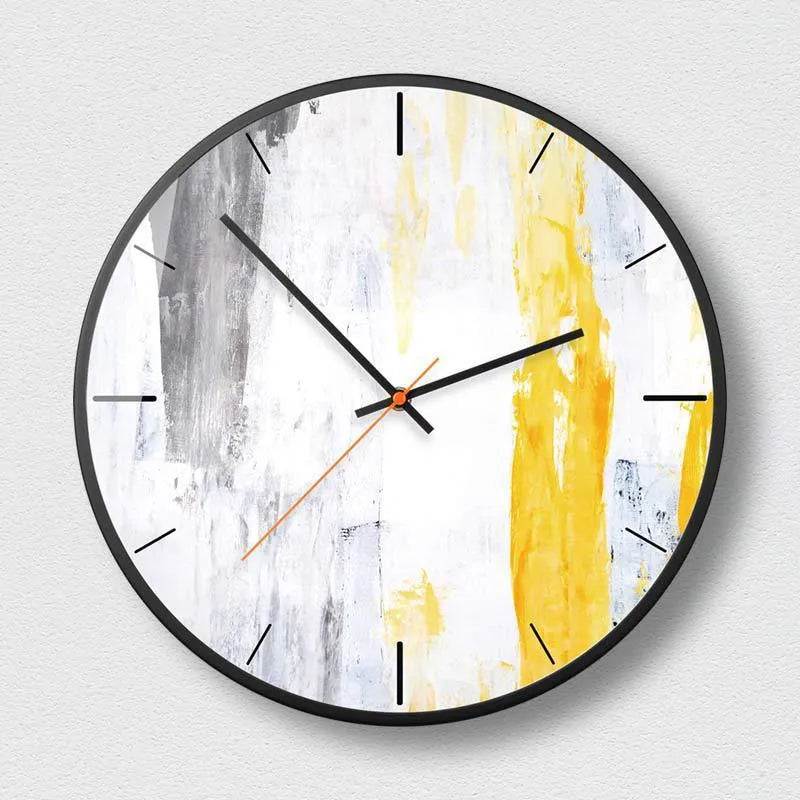 Round abstract art wall clock in black on a wall, showing hour and minute hands