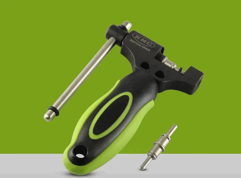 Green steel double-shaft bicycle chain rivet extractor tool on a white background.