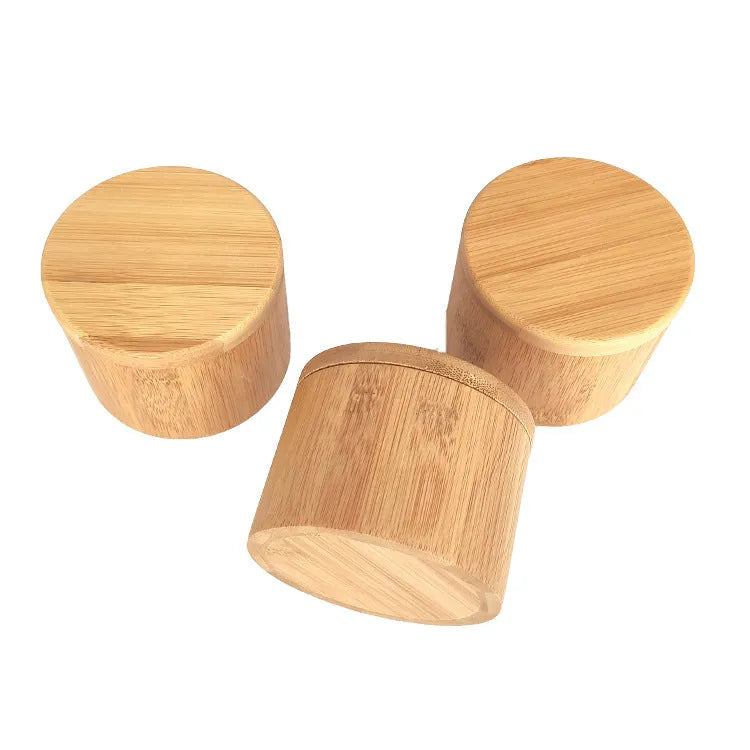 Bamboo seasoning box with a small spoon next to it on a kitchen countertop