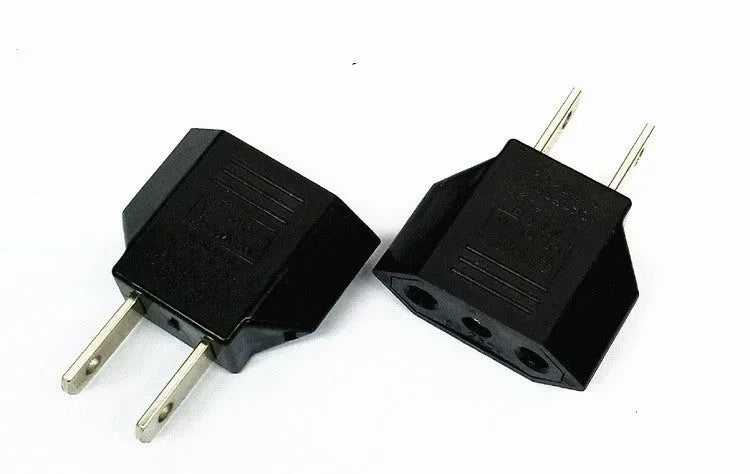 Compact black three-outlet travel plug converter adapter with AU plug type on a white background