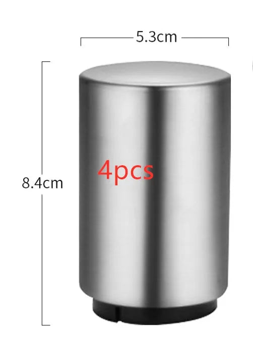 Automatic stainless steel beer bottle opener with magnetic cap catch on a table