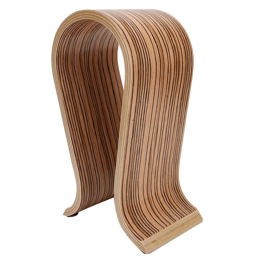 Wooden earphone holder for Bluetooth wireless headsets in brown finish on a desktop