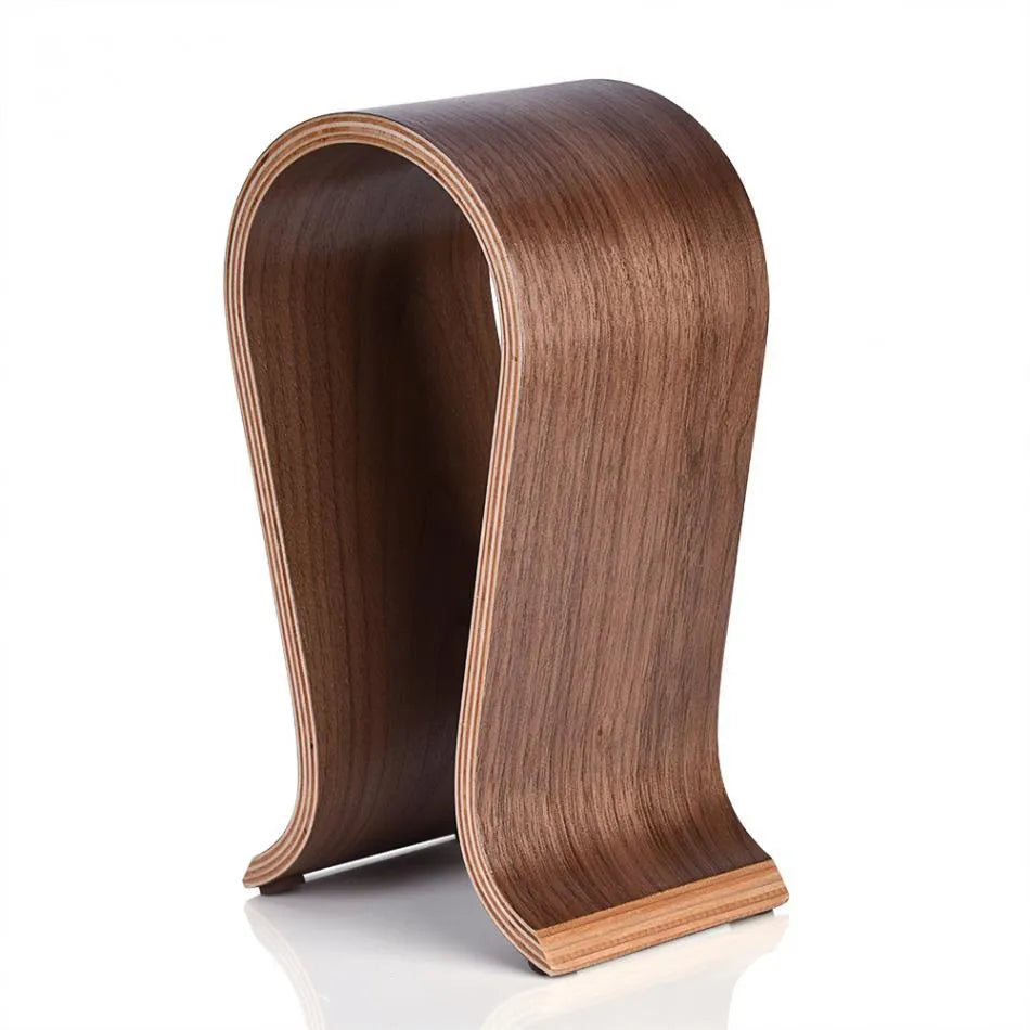 Wooden earphone holder for Bluetooth wireless headsets in brown finish on a desktop