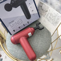 God Fascia Gun handheld massage device in black colour with USB charging port
