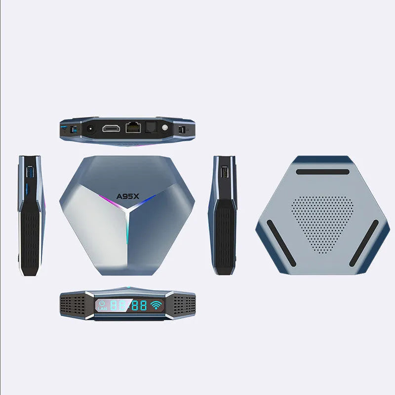 Android 8K TV set-top box with remote control and cables on a wooden surface.