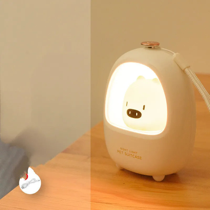 Cartoon bedside night light with touch dimming and LED soft glow on a table