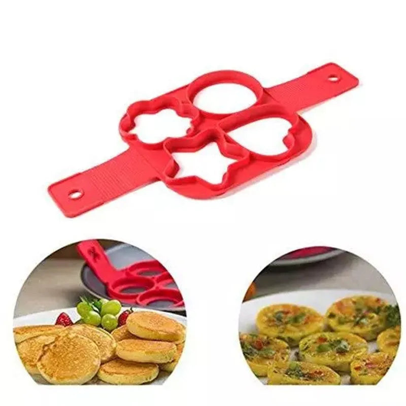 Red silicone nonstick pancake egg ring maker on a cooking surface with a round egg inside