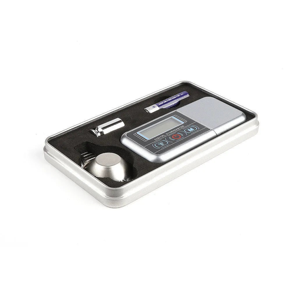Electronic scale with digital display for precise weighing up to 100g.