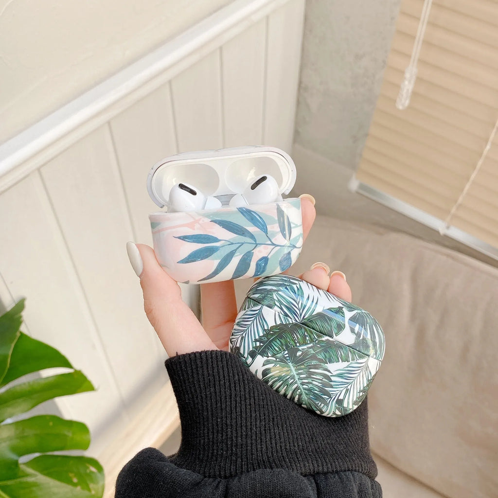 Soft blue TPU AirPods case with painted tropical banana leaf design.