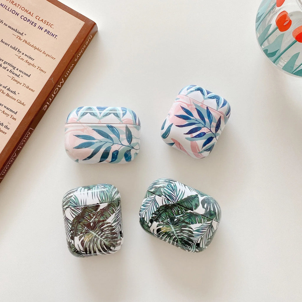 Soft blue TPU AirPods case with painted tropical banana leaf design.