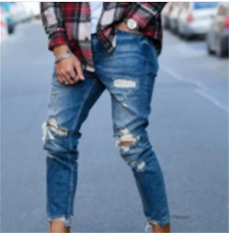 Men's distressed jeans with holes in deep blue cotton denim fabric