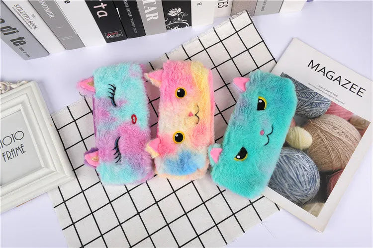 Laser colour plush pencil case with cartoon squinting face design, 21x9cm, on a plain background