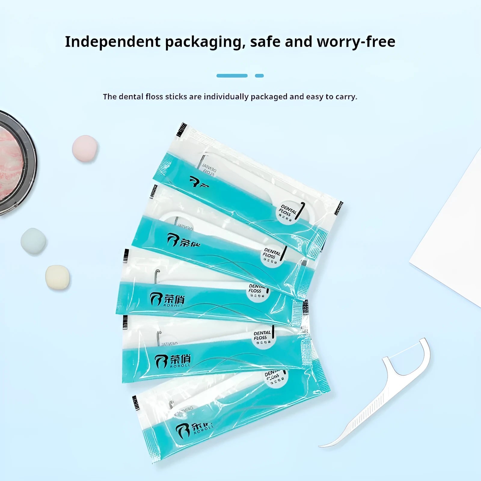 Individual single-pack dental floss pieces in plastic packaging bag for portable oral hygiene