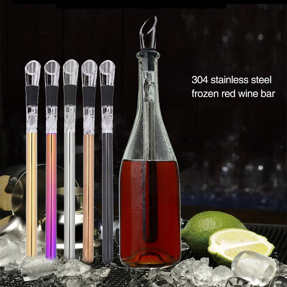 Silver stainless steel wine bottle cooler stick with built-in aerator and drip-free pouring nozzle on a table